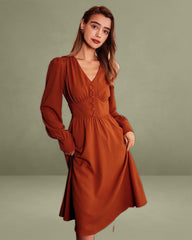The Orange V Neck Pleated Button Midi Dress