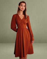 The Orange V Neck Pleated Button Midi Dress