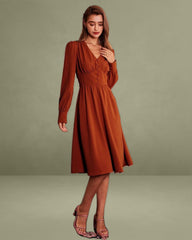 The Orange V Neck Pleated Button Midi Dress
