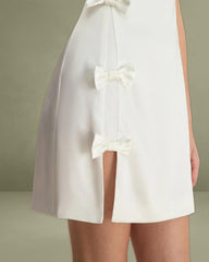 The White Boat Neck Bowknot Satin Mini Dress